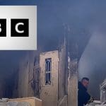 The Jenin refugee camp after Israeli forces killed nine Palestinian people and the BBC logo