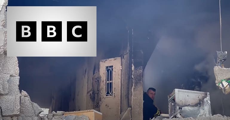 The Jenin refugee camp after Israeli forces killed nine Palestinian people and the BBC logo