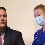 Wes Streeting looking annoyed at an NHS worker