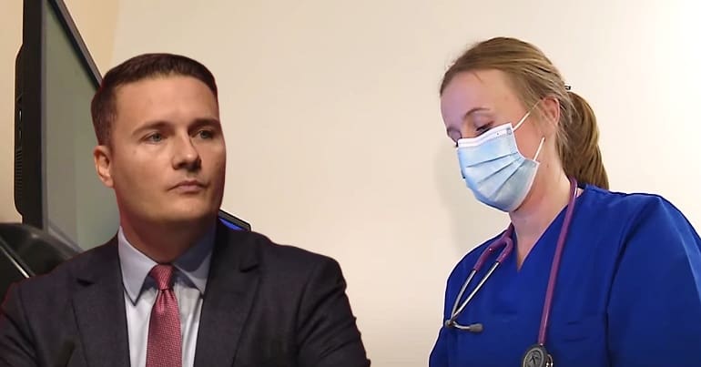 Wes Streeting looking annoyed at an NHS worker