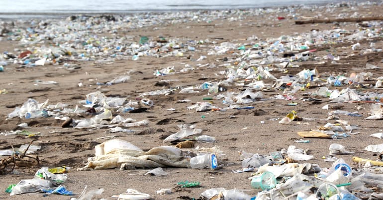 Beach littered with plastic items