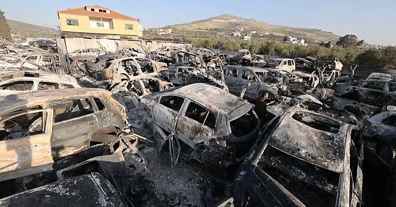 An image of dozens of burned cars after Israeli settlers rioted in Huwara attacking Palestinians