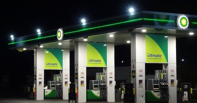 BP signs at a gas station at night