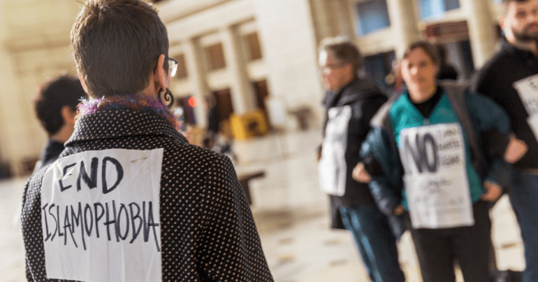 protesters hold a sign saying "End Islamophobia" Prevent strategy Shawcross