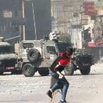 Palestinians fight back as Israel's military attacks West Bank city of Nablus