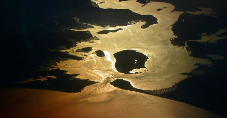 An oil spill has occurred in Wytch Farm, Poole Harbour. The harbour is here pictured from a plane. Perenco ran the field. Pollution.