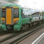 A train going quickly ticket office transport poverty