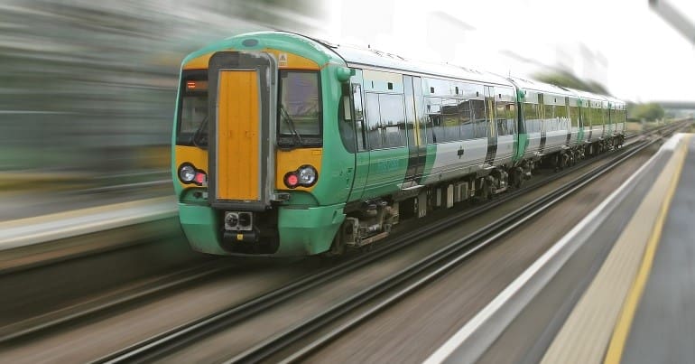 A train going quickly ticket office transport poverty