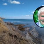 Right-wing racism by David Attenborough is platformed while Tory destruction of nature is censored. Picture of David Attenborough and a wild UK coastline in reference to the new BBC 'Wild Isles' TV series.