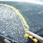 Large trawler net fishing in high seas. Illegal fishing is done by large operations like the trawl fishery pictured.