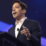 Michael Knowles speaks at a podium