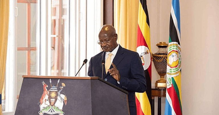 President Yoweri Museveni stands at a podium in Uganda. The state is passing anti-LGBTQ+ laws