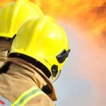 Firefighters looking onto a blaze to illustrate story about the FBU winning a pay rise for its members