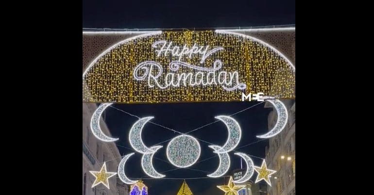 Lights display reading 'Happy Ramadan' in Piccadilly Circus, London