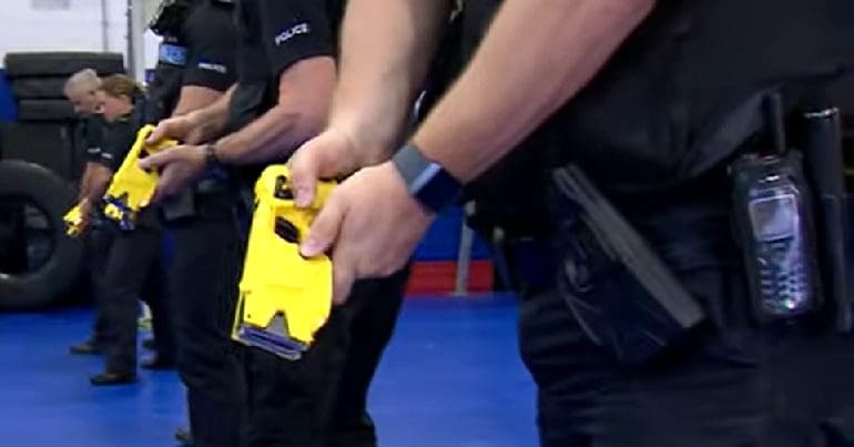 Police officers training to use tasers