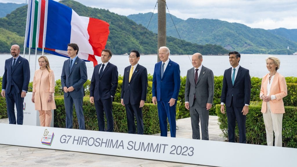 G7 leaders stand together in a line at the Hiroshima summit in May 2023.