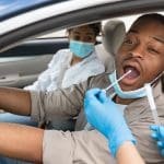 A Black family getting coronavirus testing PHE