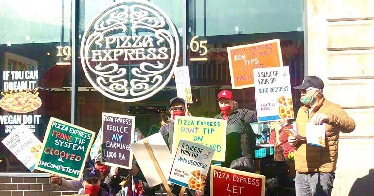 PizzaExpress workers protesting outside a shop the company has just launched a record label