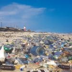 Lots of plastic bottles and other pollution on a beach in Ghana.