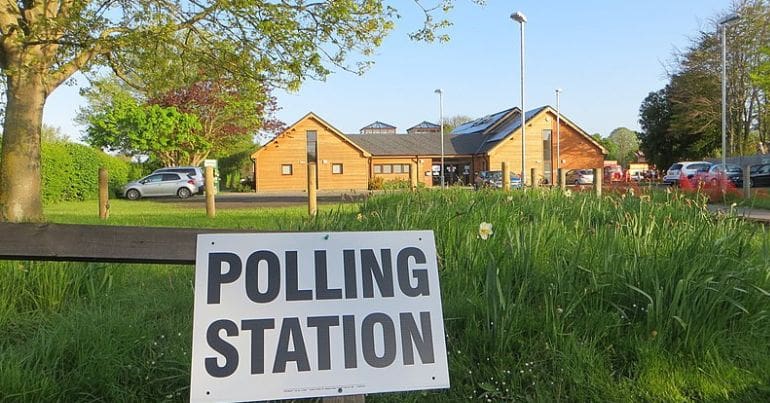 A sign saying polling station during the local elections