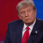 Donald Trump seated at a CNN town hall