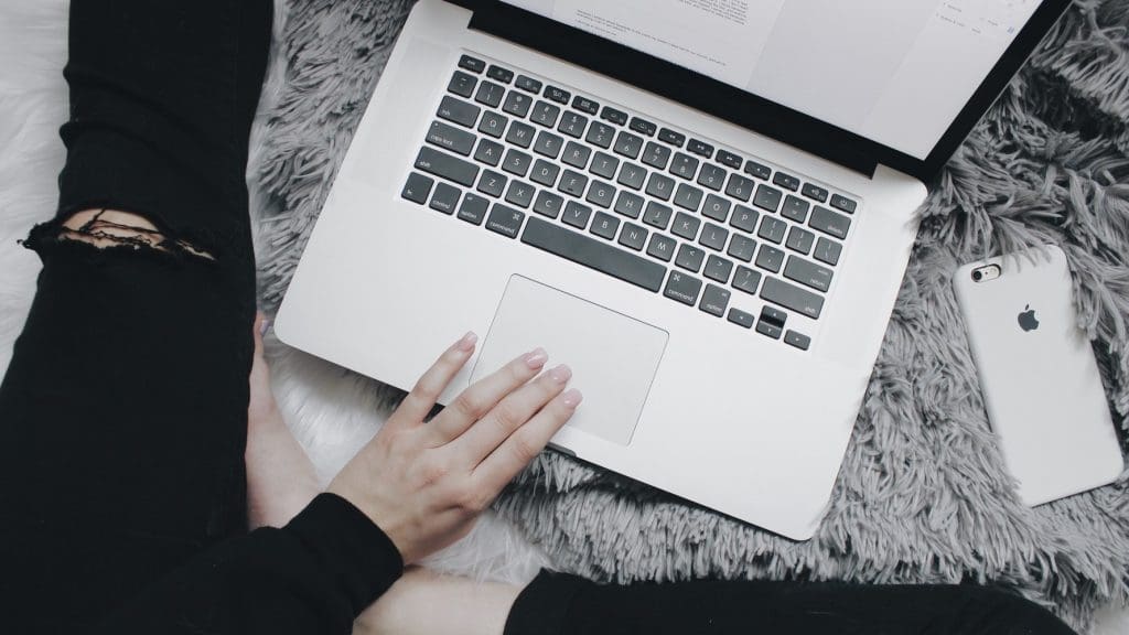 A woman sat at her laptop in relation to a recent abortion case