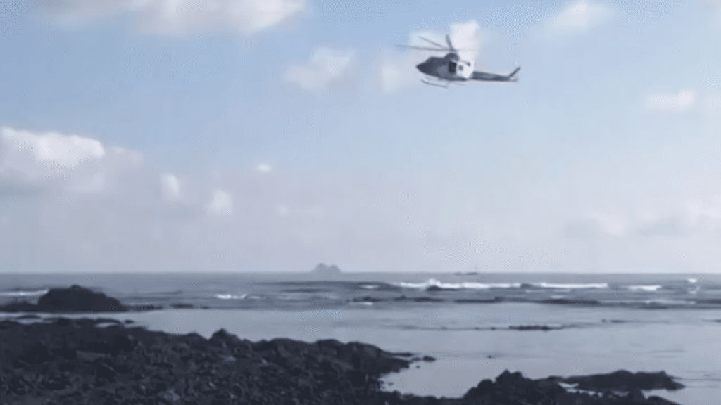 a helicopter searches for survivors after migrants die near the Canary Islands