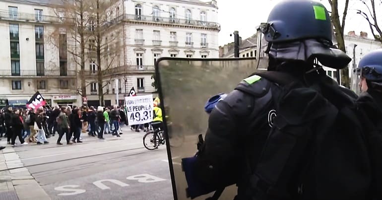 France protest with cops in the foreground as Macron pushed pensions law through