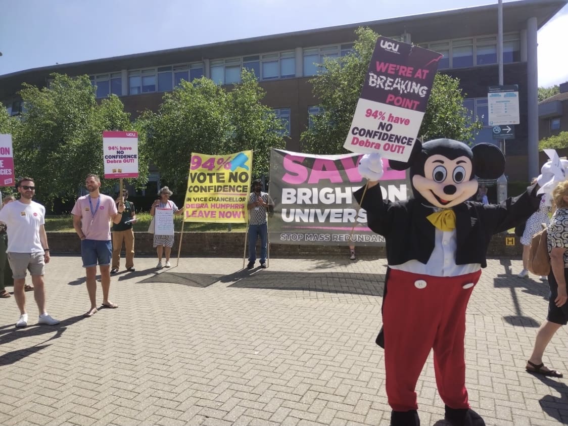 A protest with Mickey Mouse at Brighton University