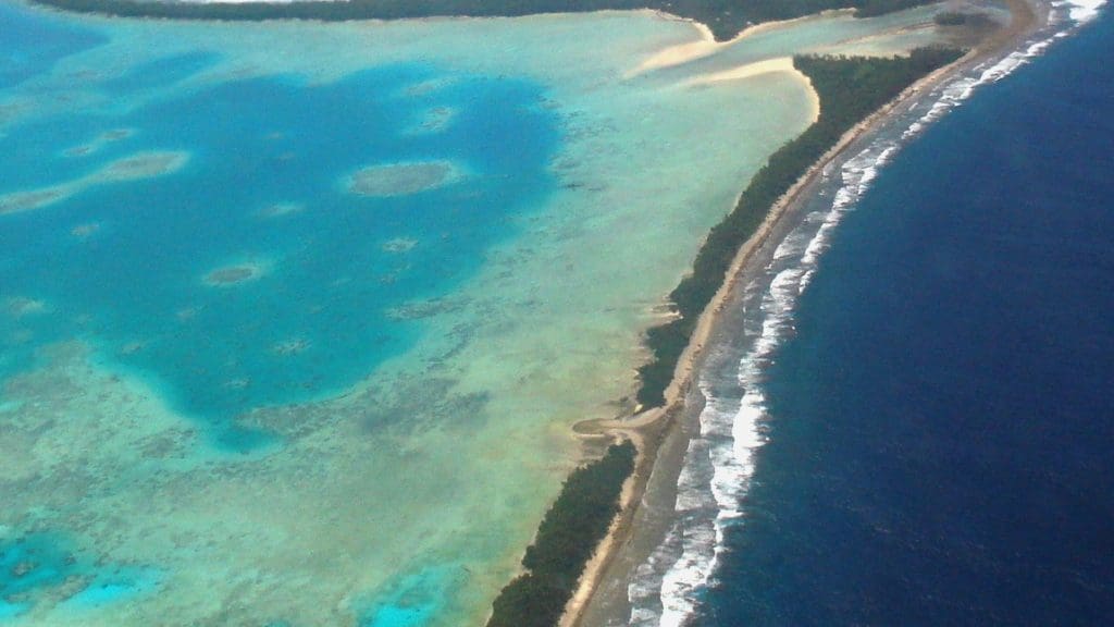 Aerial view of Tuvalu’s capital, Funafuti, 2011. Tuvalu is a remote country of low lying atolls, making it vulnerable to fossil fuel-driven climate change. Photo: Lily-Anne Homasi / DFAT