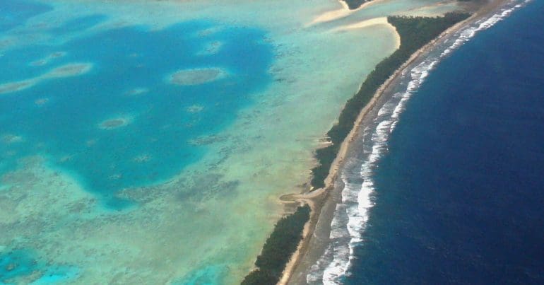 Aerial view of Tuvalu’s capital, Funafuti, 2011. Tuvalu is a remote country of low lying atolls, making it vulnerable to fossil fuel-driven climate change. Photo: Lily-Anne Homasi / DFAT