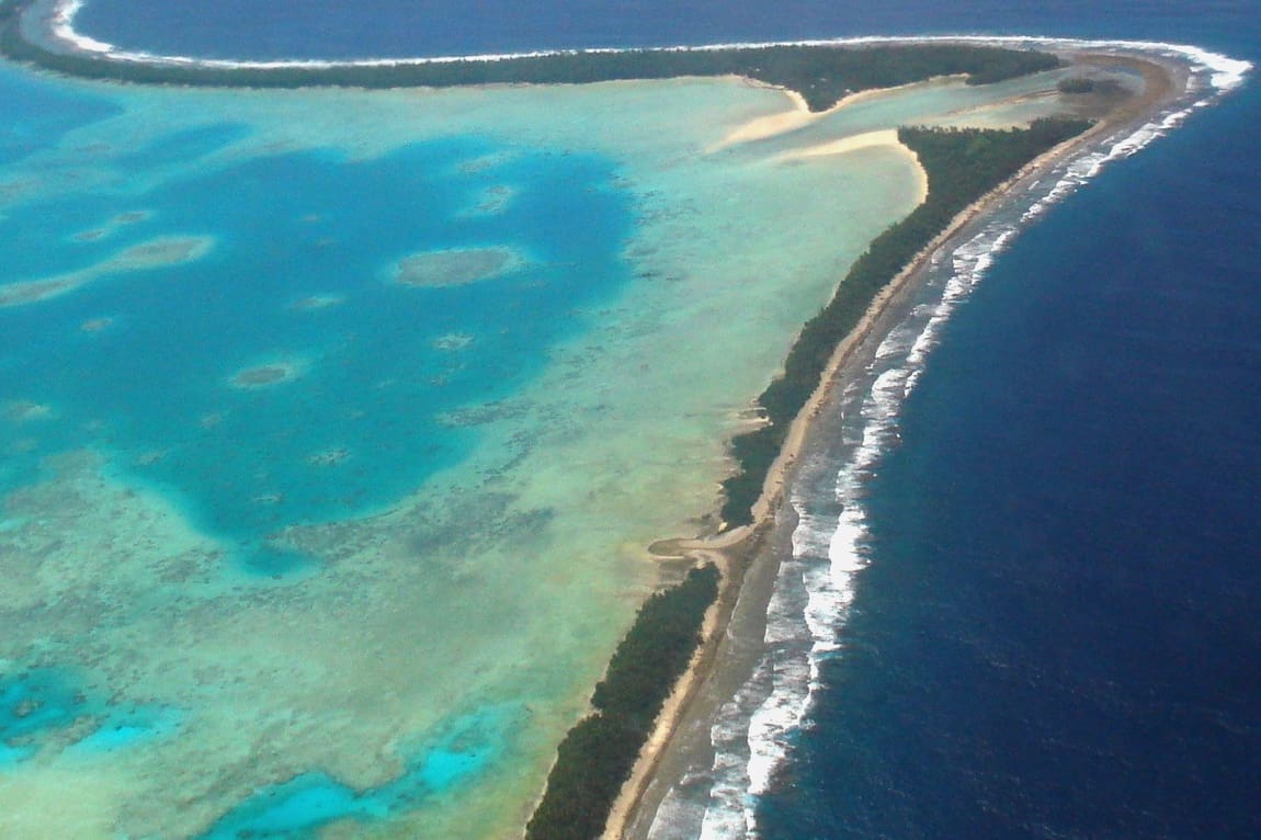 Aerial view of Tuvalu’s capital, Funafuti, 2011. Tuvalu is a remote country of low lying atolls, making it vulnerable to fossil fuel-driven climate change. Photo: Lily-Anne Homasi / DFAT