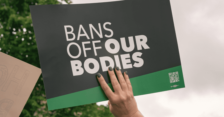 Texas abortion ban protest; sign reads "bans off our bodies"