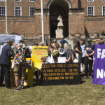 Protesters holding banners demanding 'fair buses now' in Bristol