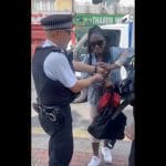 Cops arresting a Black woman in Croydon over a bus fare