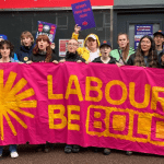 Green New Deal Rising protesters holding a banner which reads 'Labour be bold' on climate