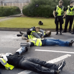 This Is Rigged activists concreted to the road at Grangemouth oil refinery as cops watch Scotland