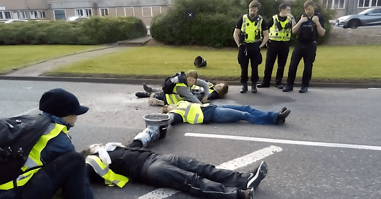 This Is Rigged activists concreted to the road at Grangemouth oil refinery as cops watch Scotland