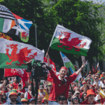Welsh independence marchers waving Welsh flags Wales Cymru AUOBCymru