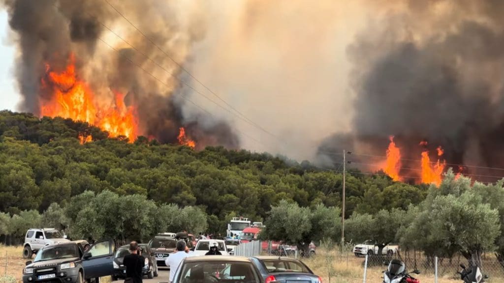 Wildfire rages outside of Athens, Greece, as signs of the climate crisis become very visible