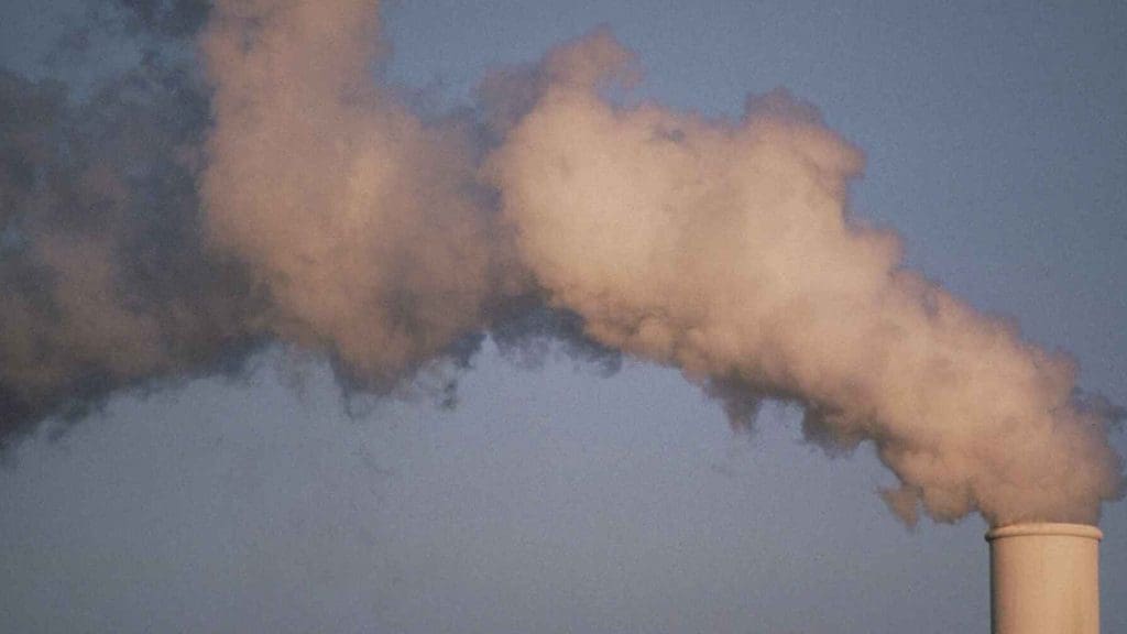 Pollution rising from a smoke-stack. Climate GHG Emissions
