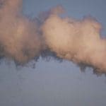 Pollution rising from a smoke-stack. Climate GHG Emissions