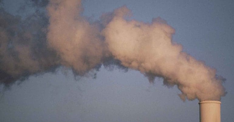 Pollution rising from a smoke-stack. Climate GHG Emissions