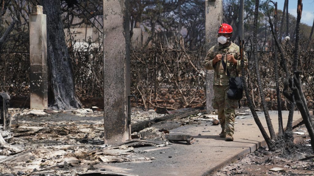 Wreckage from the wildfires in Hawaii, showing burned down buildings and rubble.