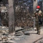 Wreckage from the wildfires in Hawaii, showing burned down buildings and rubble.