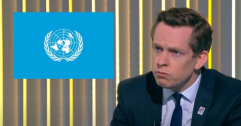 Tory minister Tom Pursglove looking at the UN logo UNCRPD disabled people