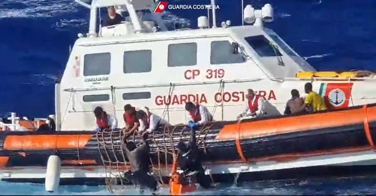 Italian Coast Guard rescuing migrants in the Mediterranean sea