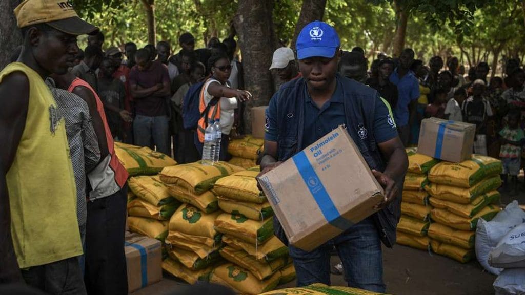 World Food Programme aid worker distributes food in Mozambique UN humanitarian