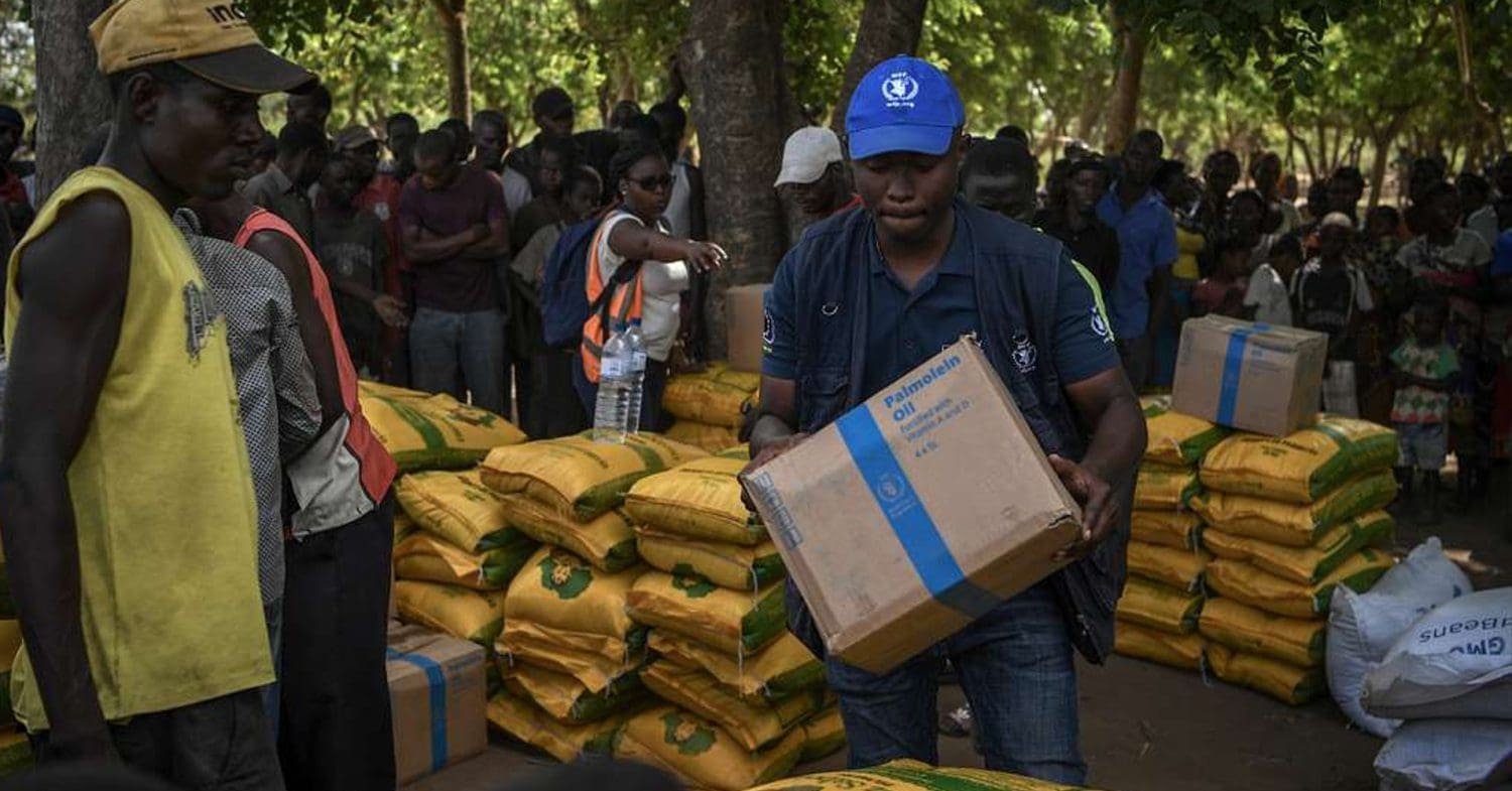 World Food Programme aid worker distributes food in Mozambique UN humanitarian