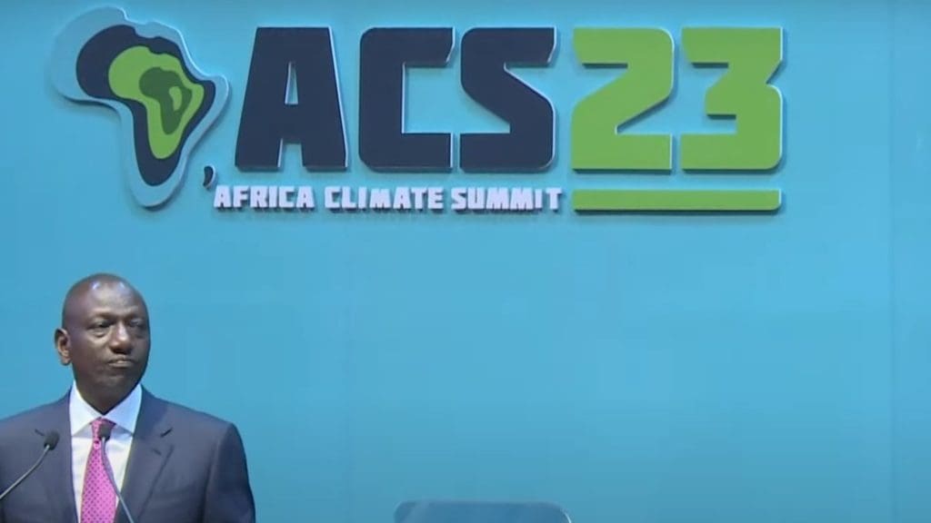 President of Kenya William Ruto stands on stage at the Africa Climate Summit.